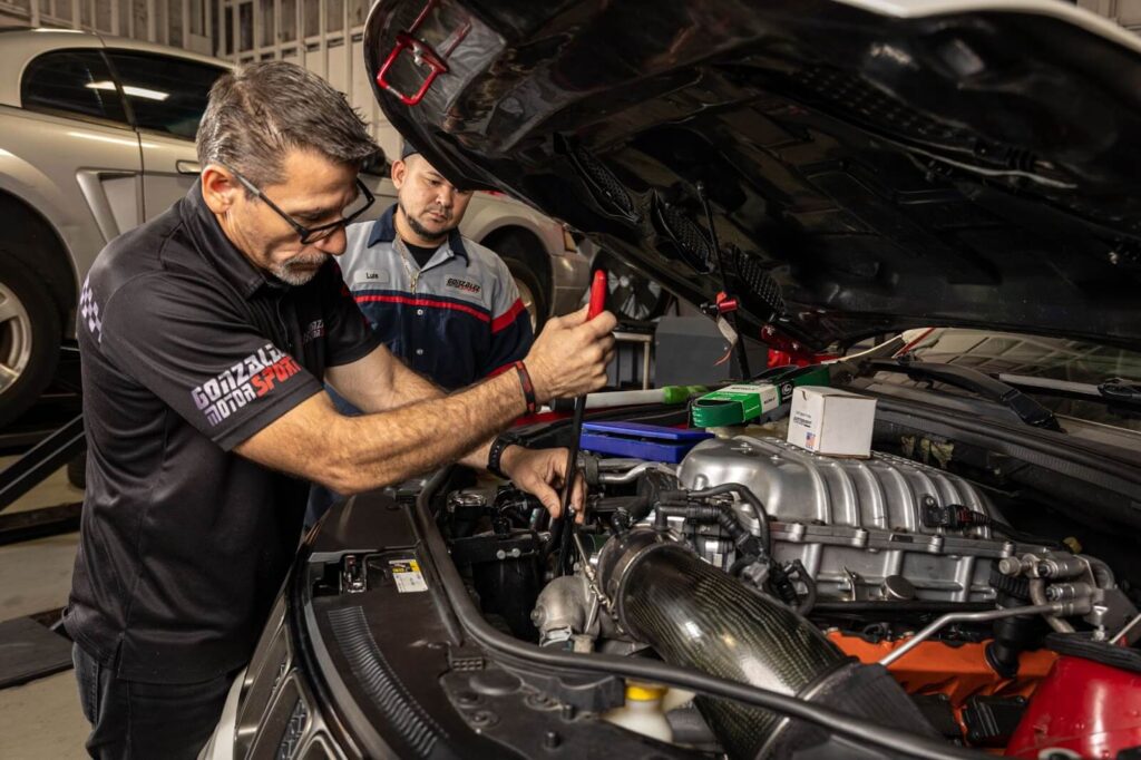 Comprehensive vehicle check-up by a professional mechanic, highlighting the all-inclusive care at Gonzalez MotorSport.